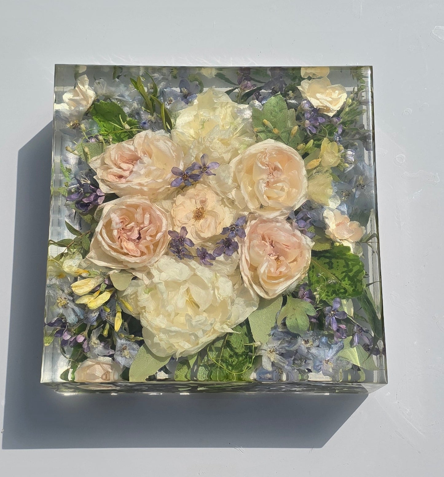 wedding bouquet preserved in a clear resin block  handmade by Alma Makes
