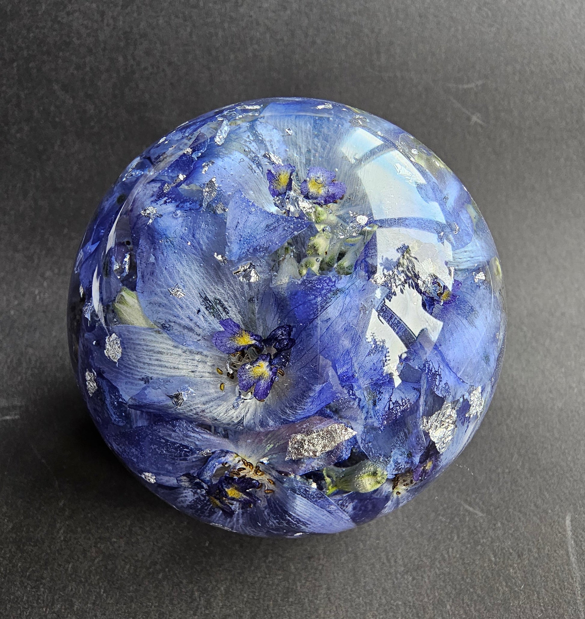 Wedding flowers preserved in a 3" resin sphere keepsake