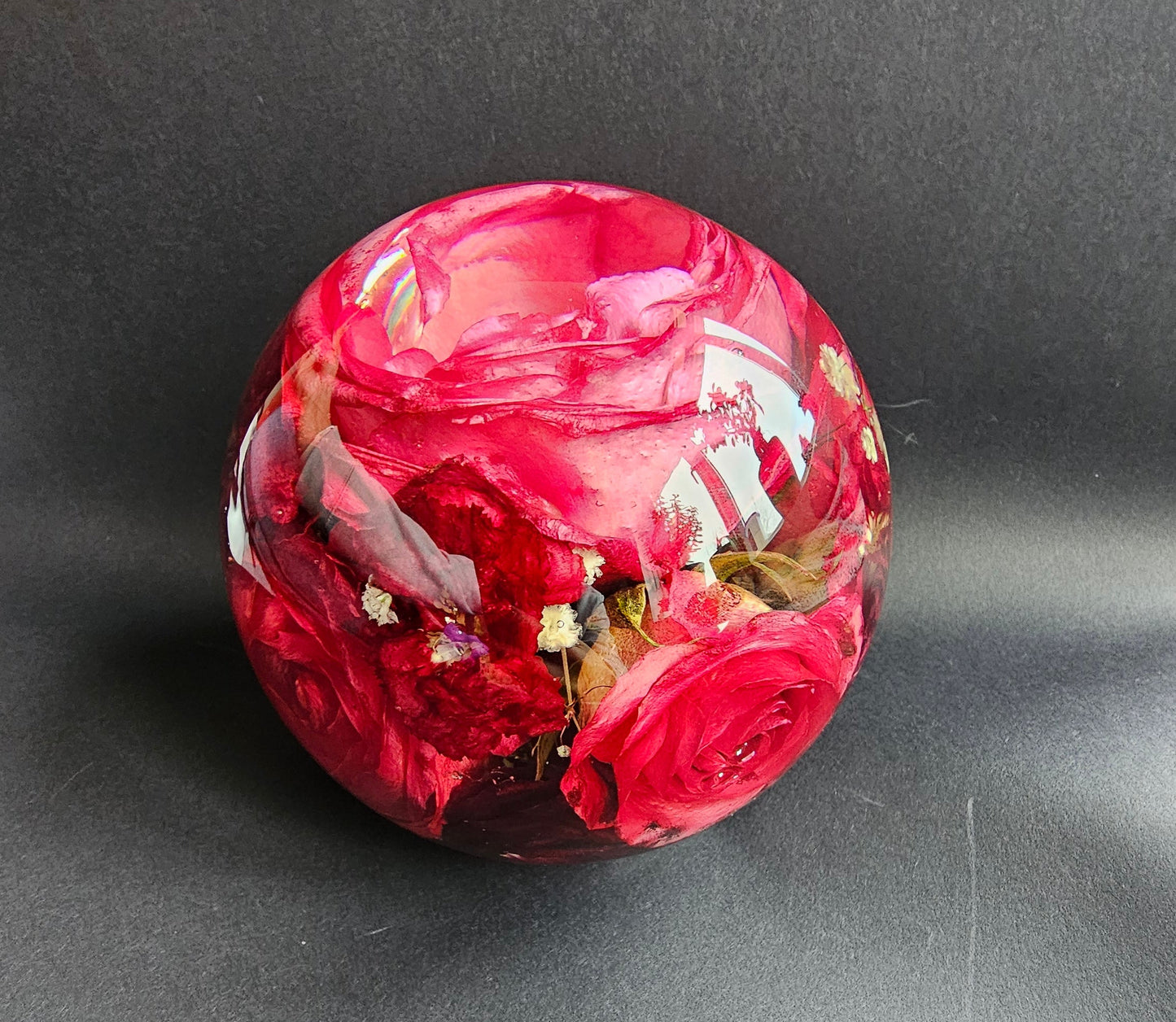 Wedding flowers preserved in a clear 5" resin sphere keepsake