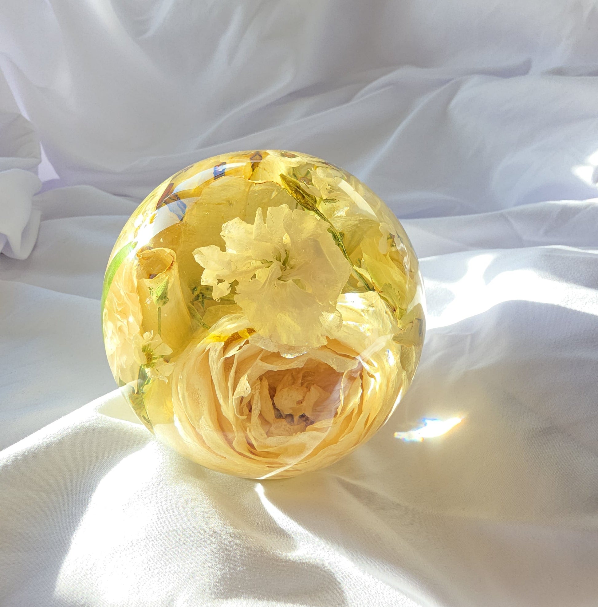 Memorial flowers preserved in a 5"resin sphere keepsake
