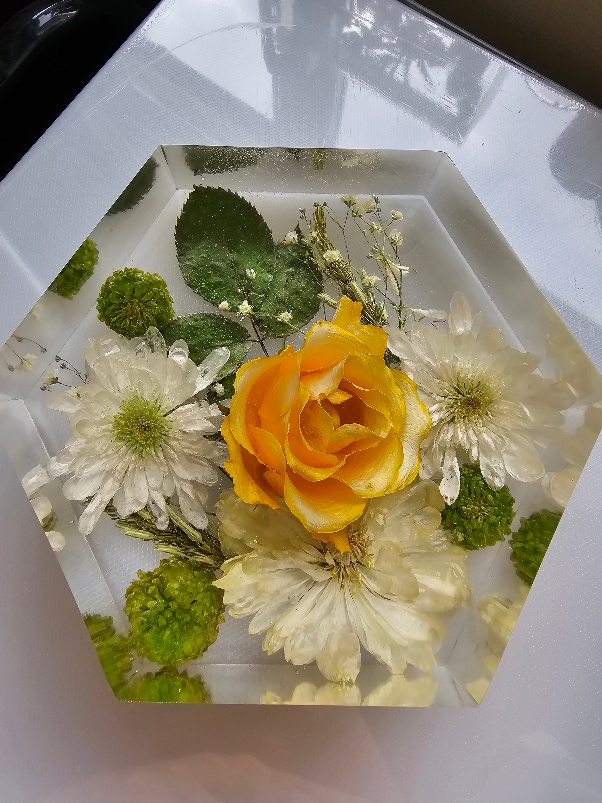 flowers preserved in a 6x6 hexagon keepsake