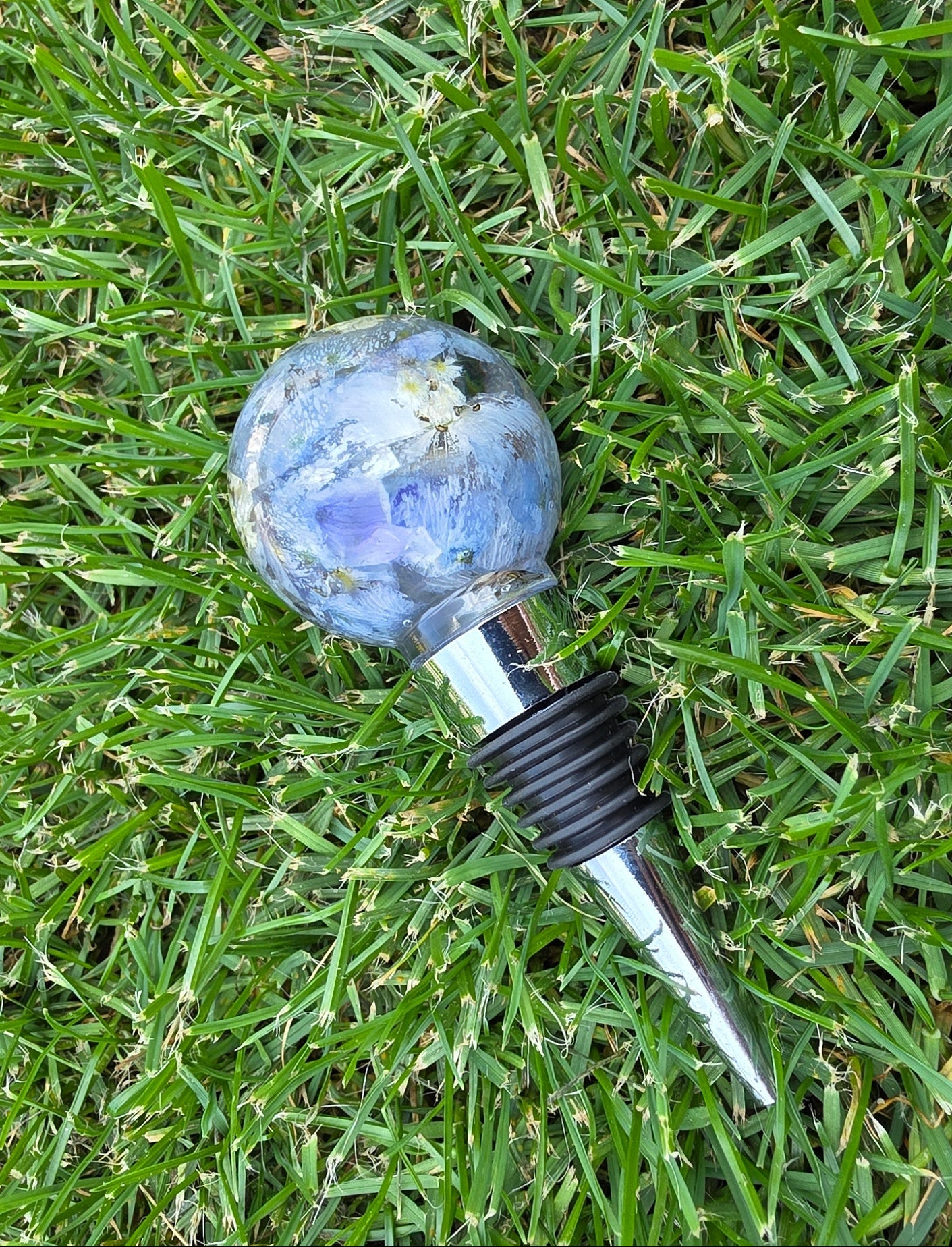 Custom floral resin wine bottle stopper with preserved flowers, handmade by Alma Makes