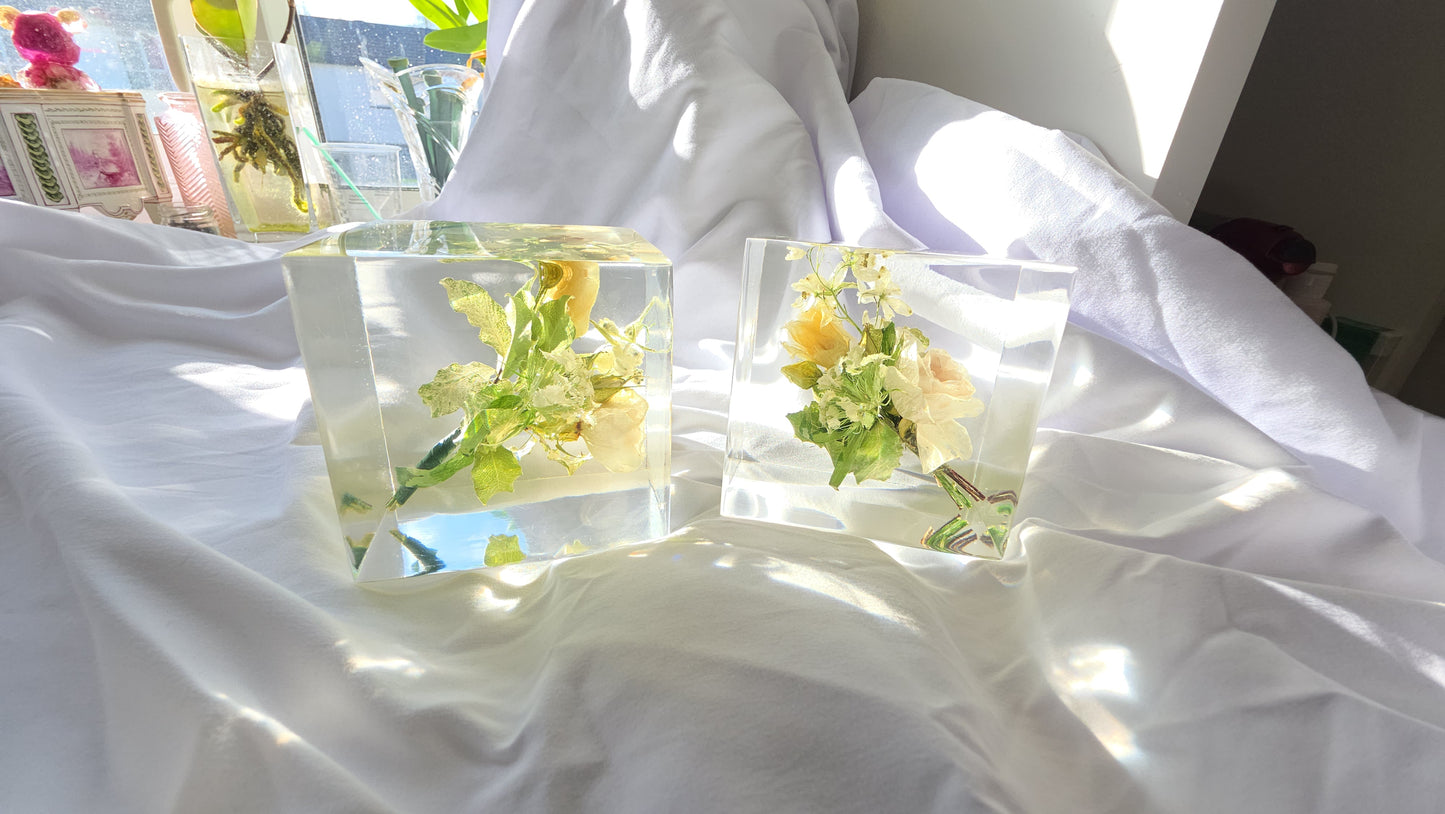 Wedding boutonnière preserved in a clear resin block with PRESERVED FLOWERS