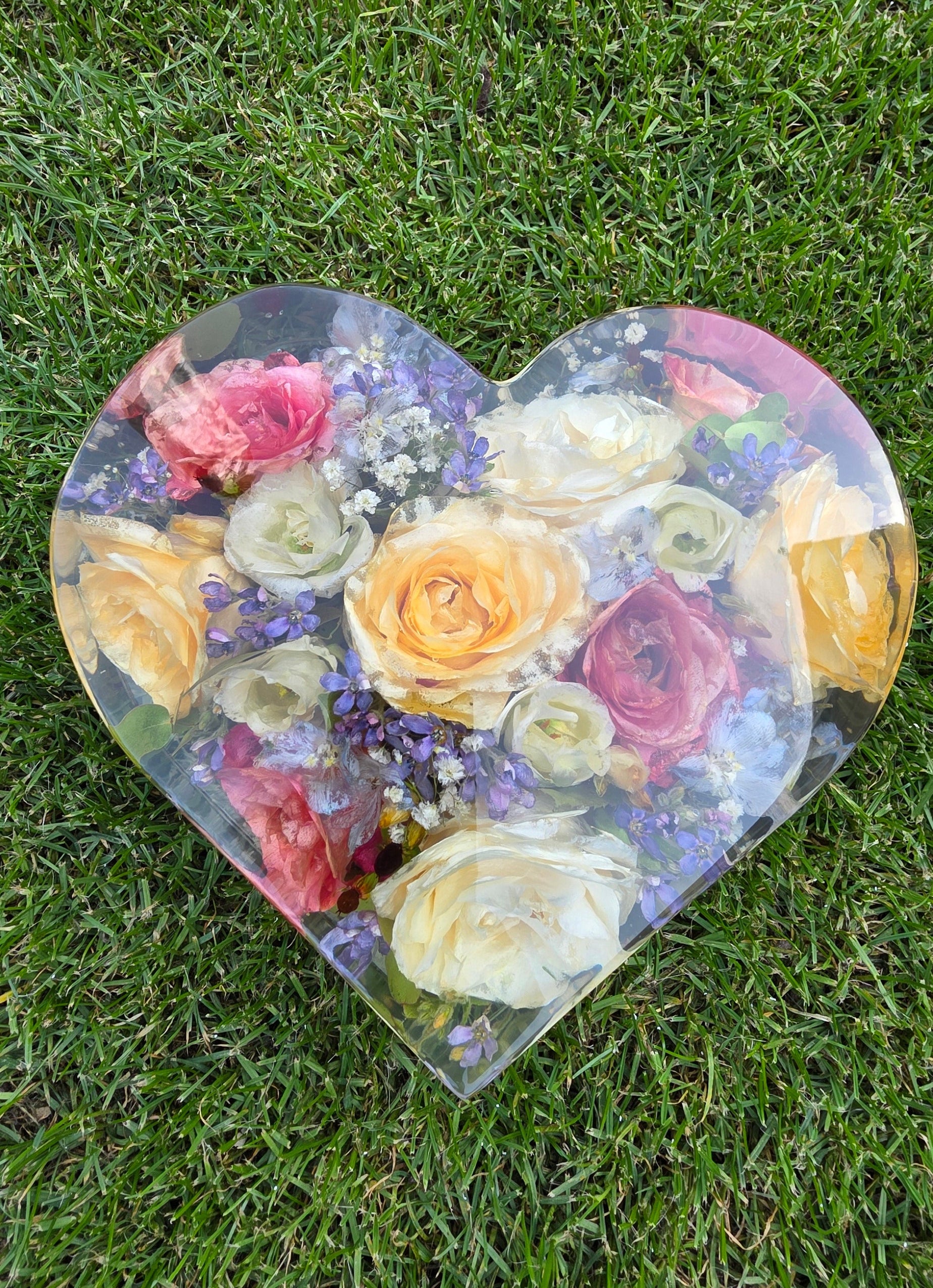 Wedding bouquet preserved in a heart-shaped resin block , handmade by Alma Makes