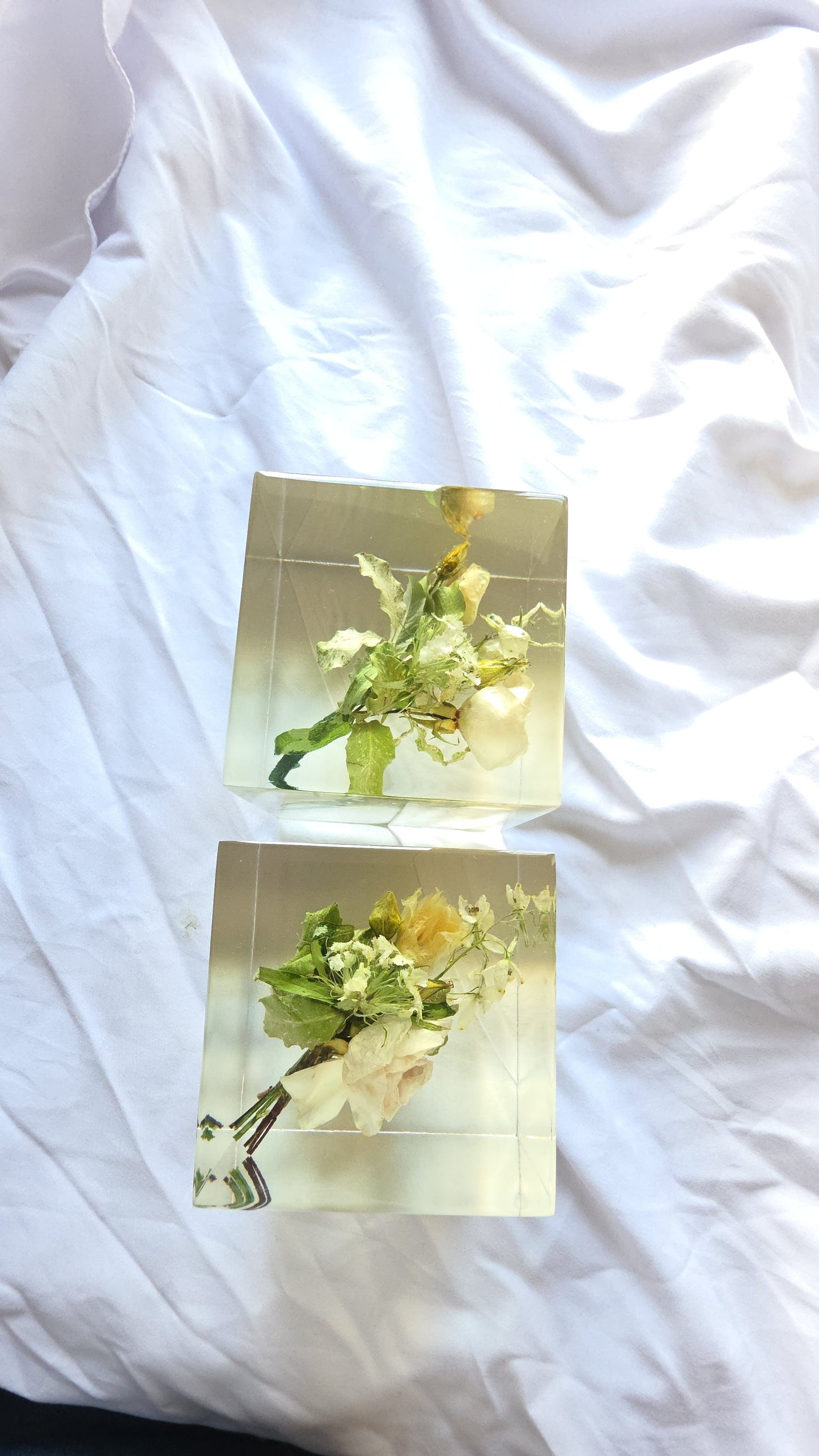 Wedding boutonnière preserved in a clear resin block with PRESERVED FLOWERS