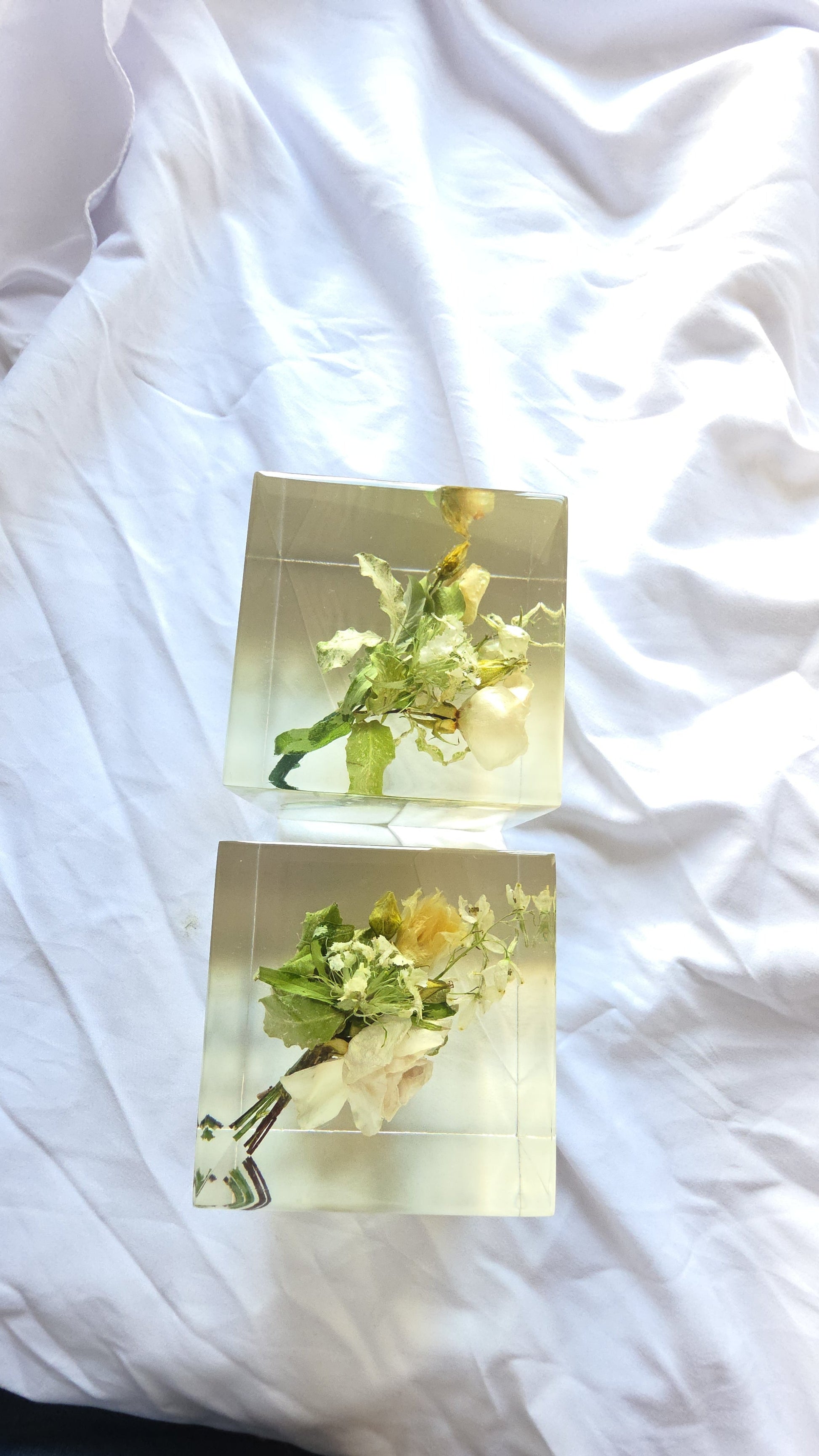 Wedding boutonnière preserved in a clear resin block with PRESERVED FLOWERS